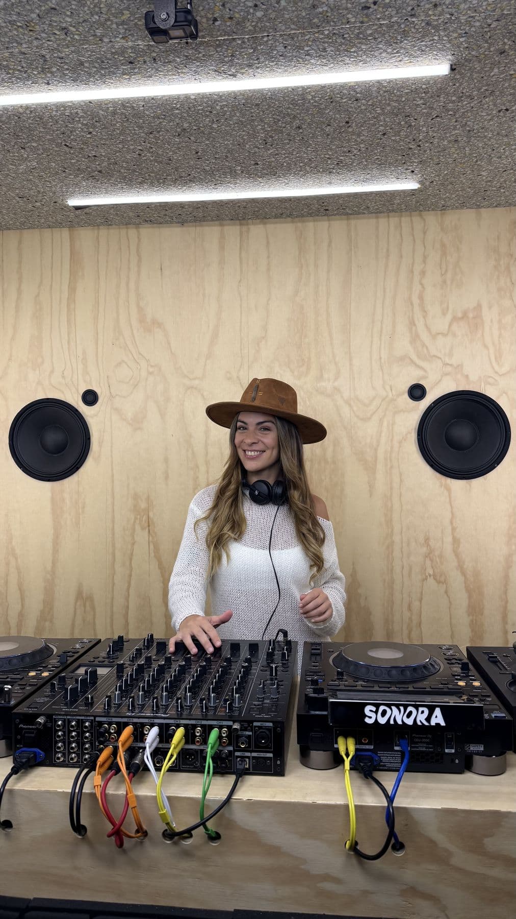Studio session in a brown hat at the decks