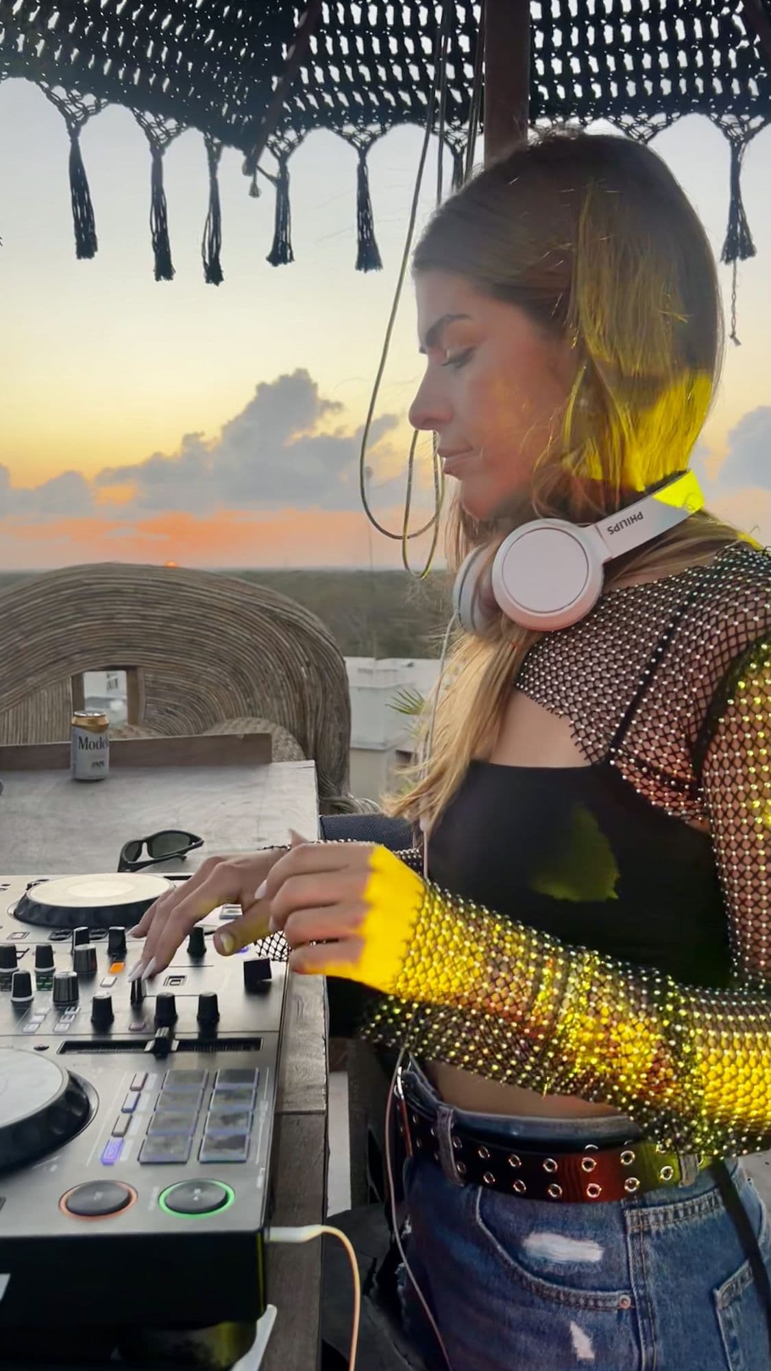 Rooftop at sunset, headphones on